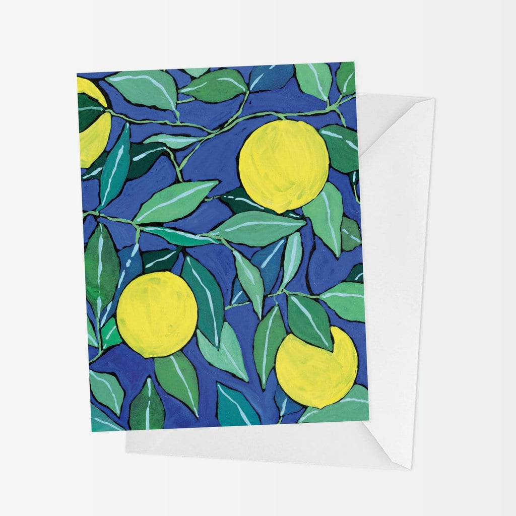 A2 sized greeting card with bright yellow lemons and leaves in various shades of green on a cobalt blue background, forming a pattern that looks almost like stained glass. The card has no message on the front and is blank inside and comes with a coordinating white envelope. 