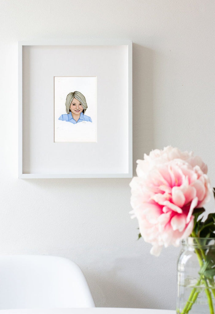 Martha Stewart portrait in gouache by Liz Langley framed in white frame
