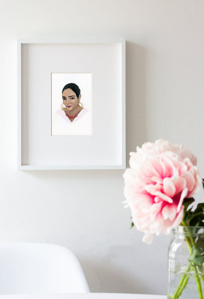 Shirin Neshat portrait in gouache by Liz Langley framed in white frame