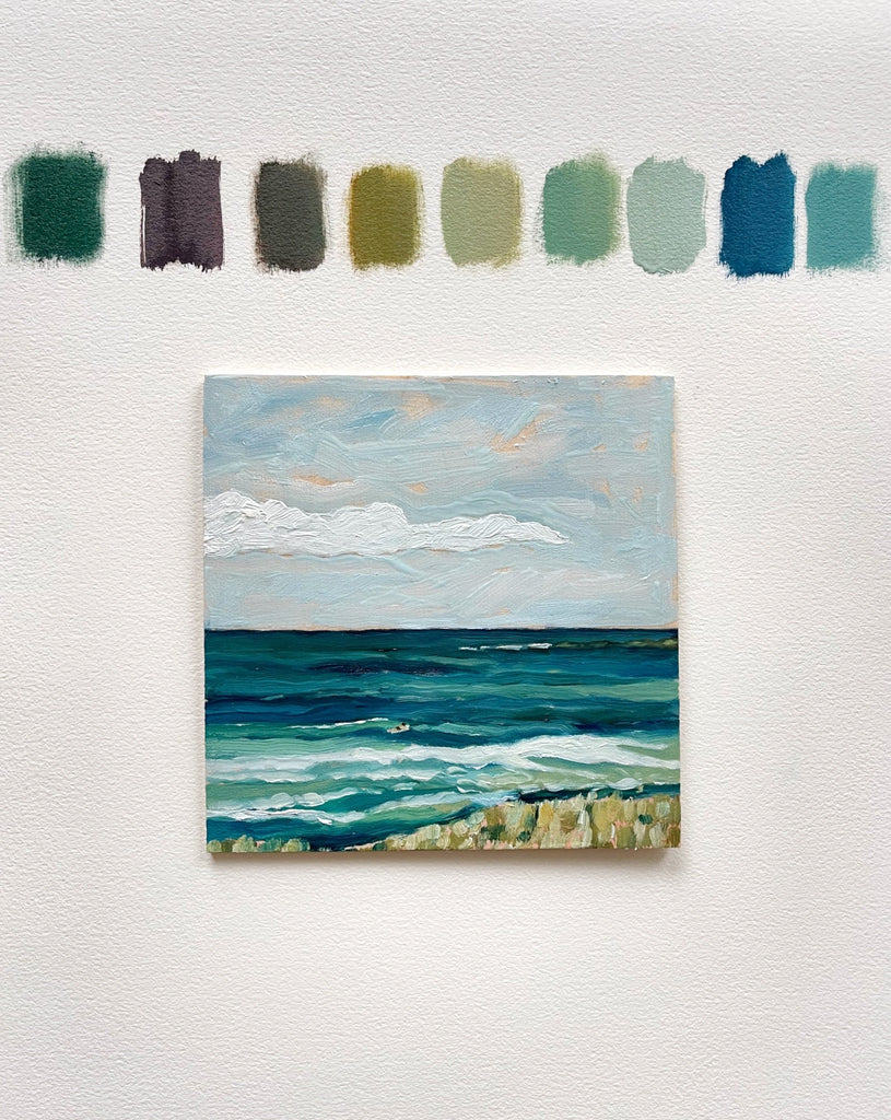 Detail of 6x6 mini seascape by Liz Langley Studio: a surfer paddles out to a gentle wave in a palette of peaceful blues and greens, shown unframed next to color swatches
