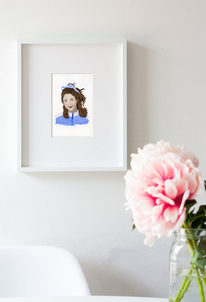 Kathrine Switzer portrait in gouache by Liz Langley framed in white frame