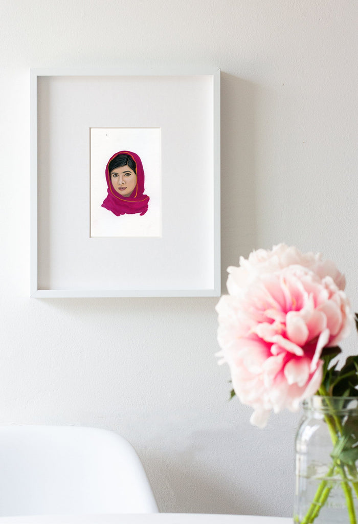 Malala Yousafzai portrait in gouache by Liz Langley framed in white frame