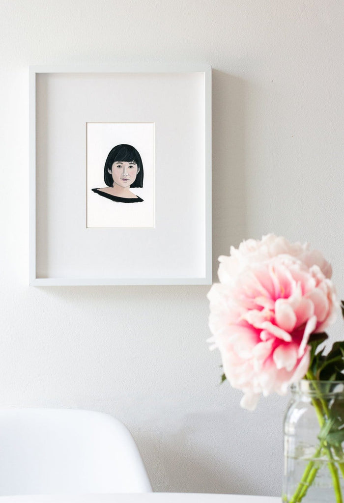 Maya Lin portrait in gouache by Liz Langley framed in white frame