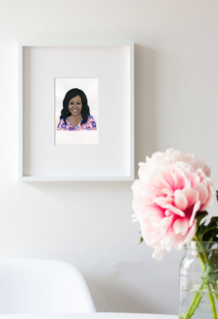 Michelle Obama portrait in gouache by Liz Langley framed in white frame