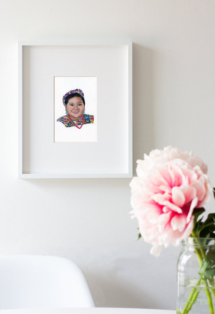 Rigoberta Menchú portrait in gouache by Liz Langley framed in white frame