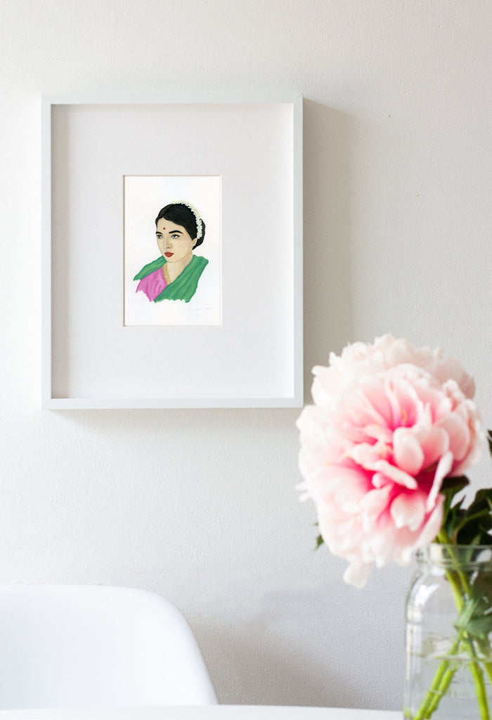 Rukmini Devi portrait in gouache by Liz Langley framed in white frame