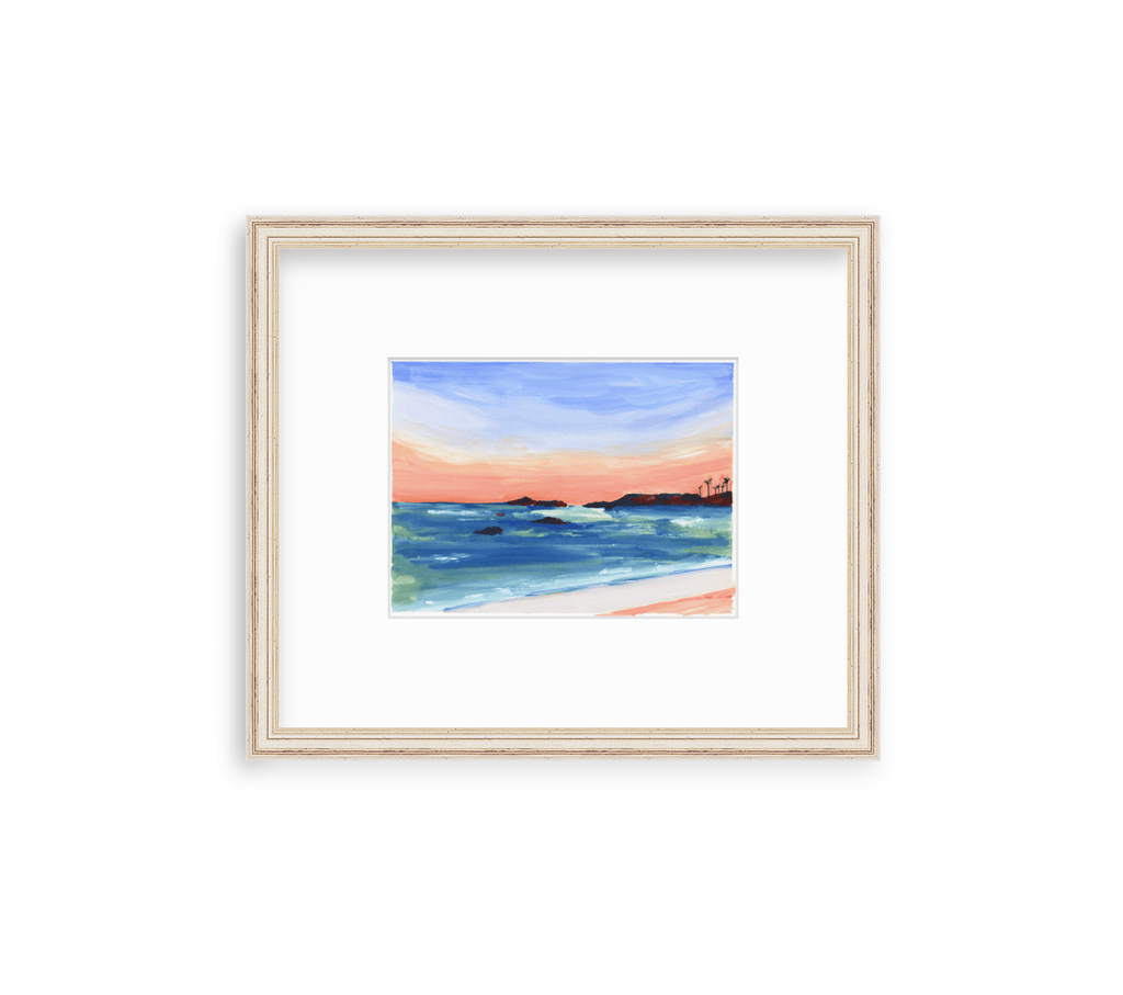 6x8 inch gouache seascape painting on paper captures the sunset sky and seaviews at Punta Mita in Mexico. Deep blue, purple, golden yellow and coral sweep across the sky, and the sea is deep aqua, turquoise and blue, with coral highlights on the water and beach. A few rocky outcroppings dot the ocean, along with a cluster of palms on the distant peninsula. It is matted in an off white and distressed gold frame by framebridge.